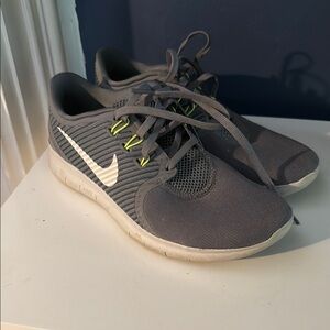 Gray and White Nike Free Run CMTR